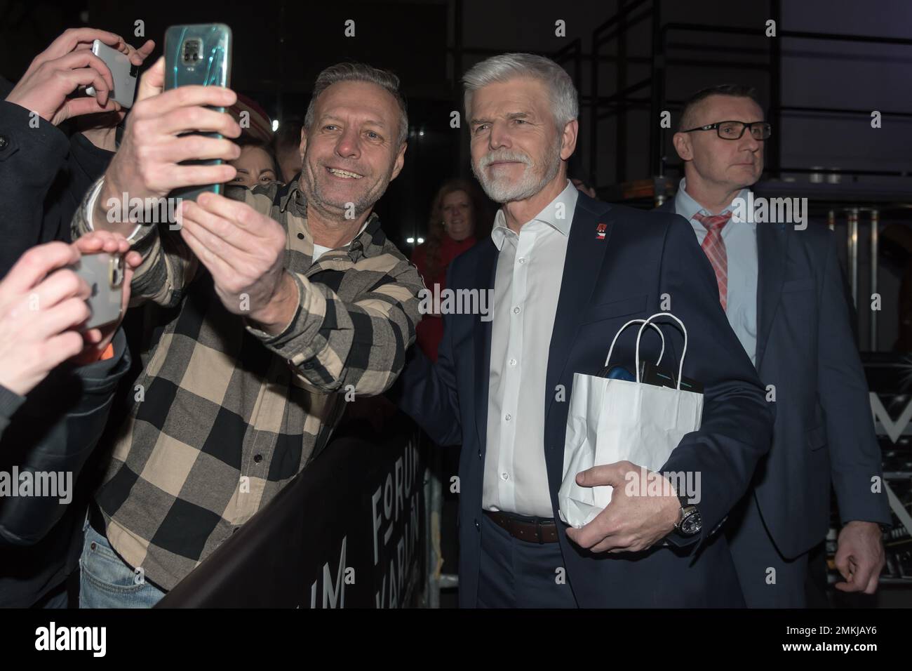 Prague, Czech Republic. 28th Jan, 2023. A supporter seen taking selfies using a mobile phone together with winner of Czech presidential elections PETR PAVEL, (R) at his campaign headquarter in Prague. Pavel wins the presidential elections, outpacing former Czech prime minister, chairman of political movement ANO and billionaire Andrej Babis. (Credit Image: © Tomas Tkacik/SOPA Images via ZUMA Press Wire) EDITORIAL USAGE ONLY! Not for Commercial USAGE! Stock Photo