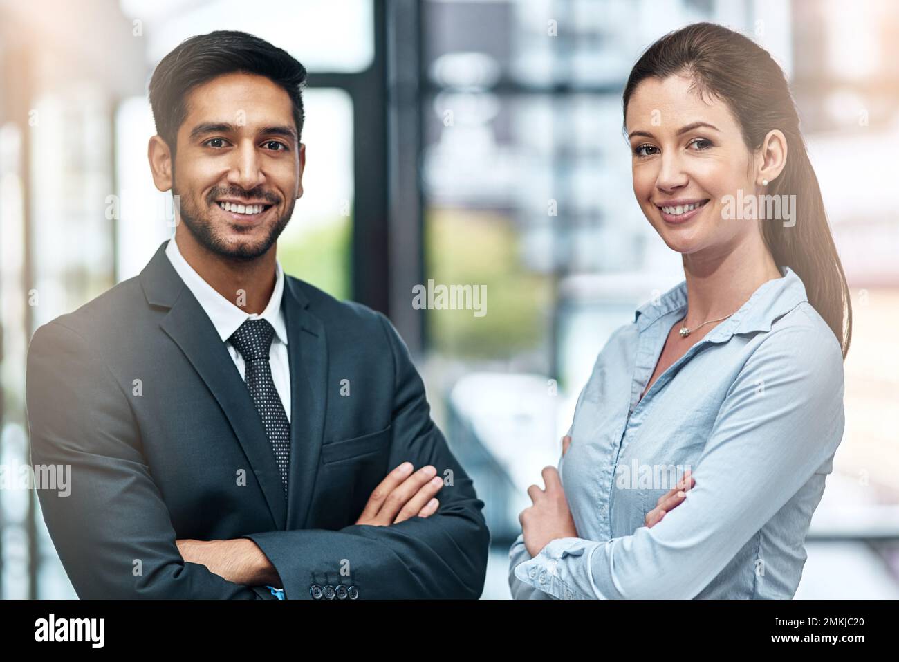 We have a reputation for doing good work. two businesspeople standing side by side. Stock Photo