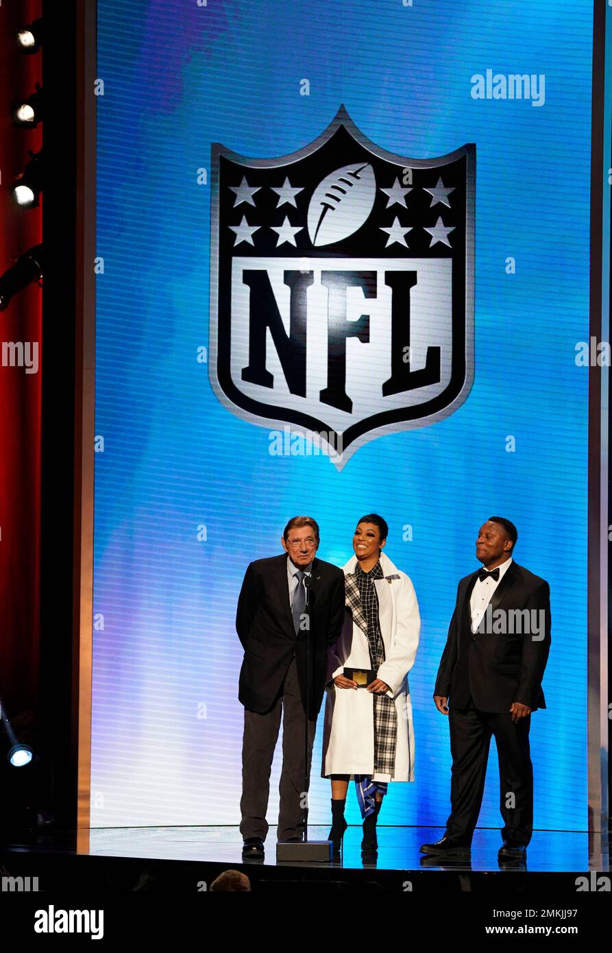 Former NFL player Joe Namath, from left, Monica, and former NFL player  Barry Sanders the award for AP coach of the year at the 8th Annual NFL  Honors at The Fox Theatre