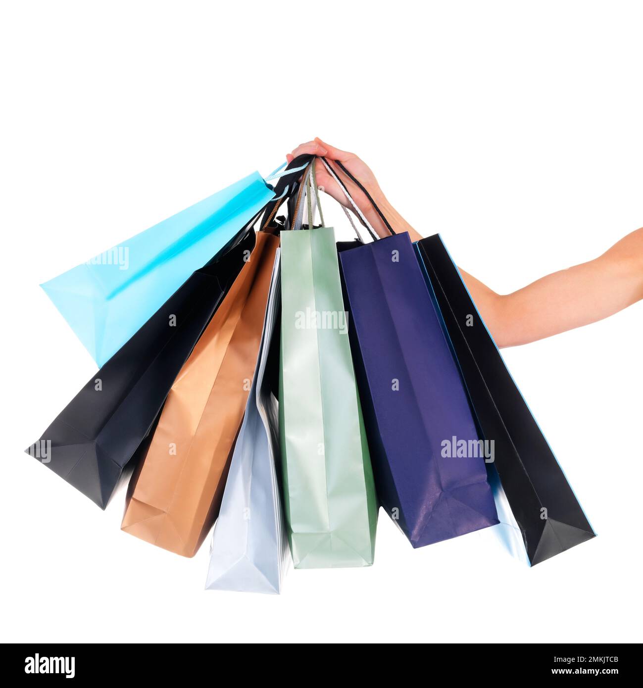 Bags of bargain buys. a young woman carrying shopping bags isolated on white. Stock Photo