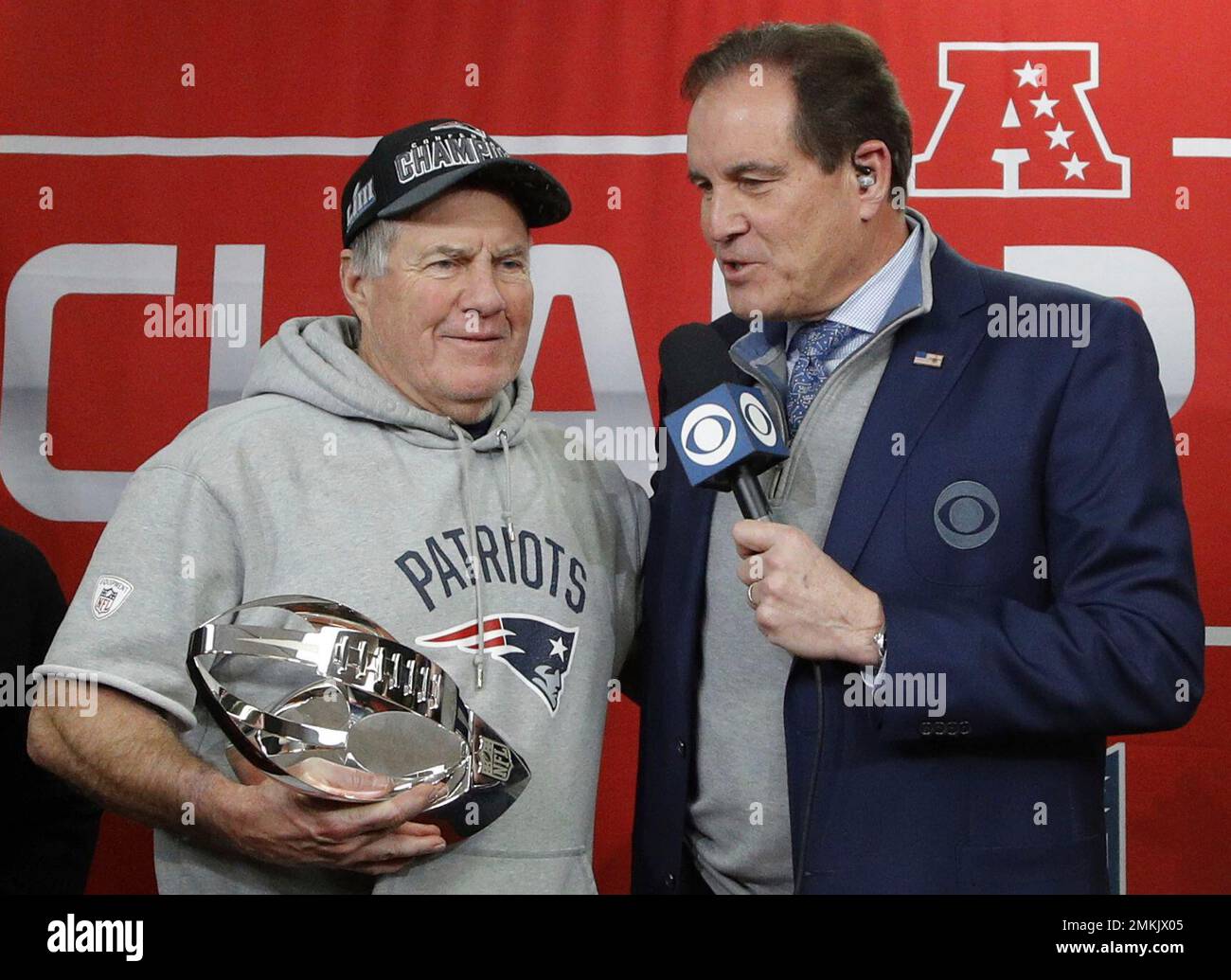 CBS Sports broadcaster Jim Nantz (left) and former Kansas Chiefs and Pro  Football Hall of Fame linebacker Bobby Bell present the Lamar Hunt trophy  after the AFC Championship against the Tennessee Titans, Sunday, Jan 19,  2020, in Kansas City, Mo