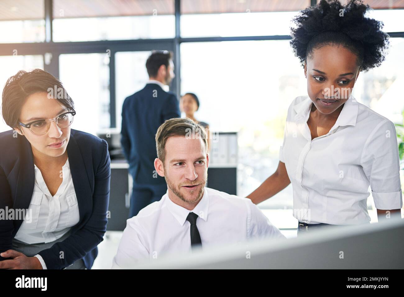 Theyll achieve success together. a group of businesspeople gathered ...