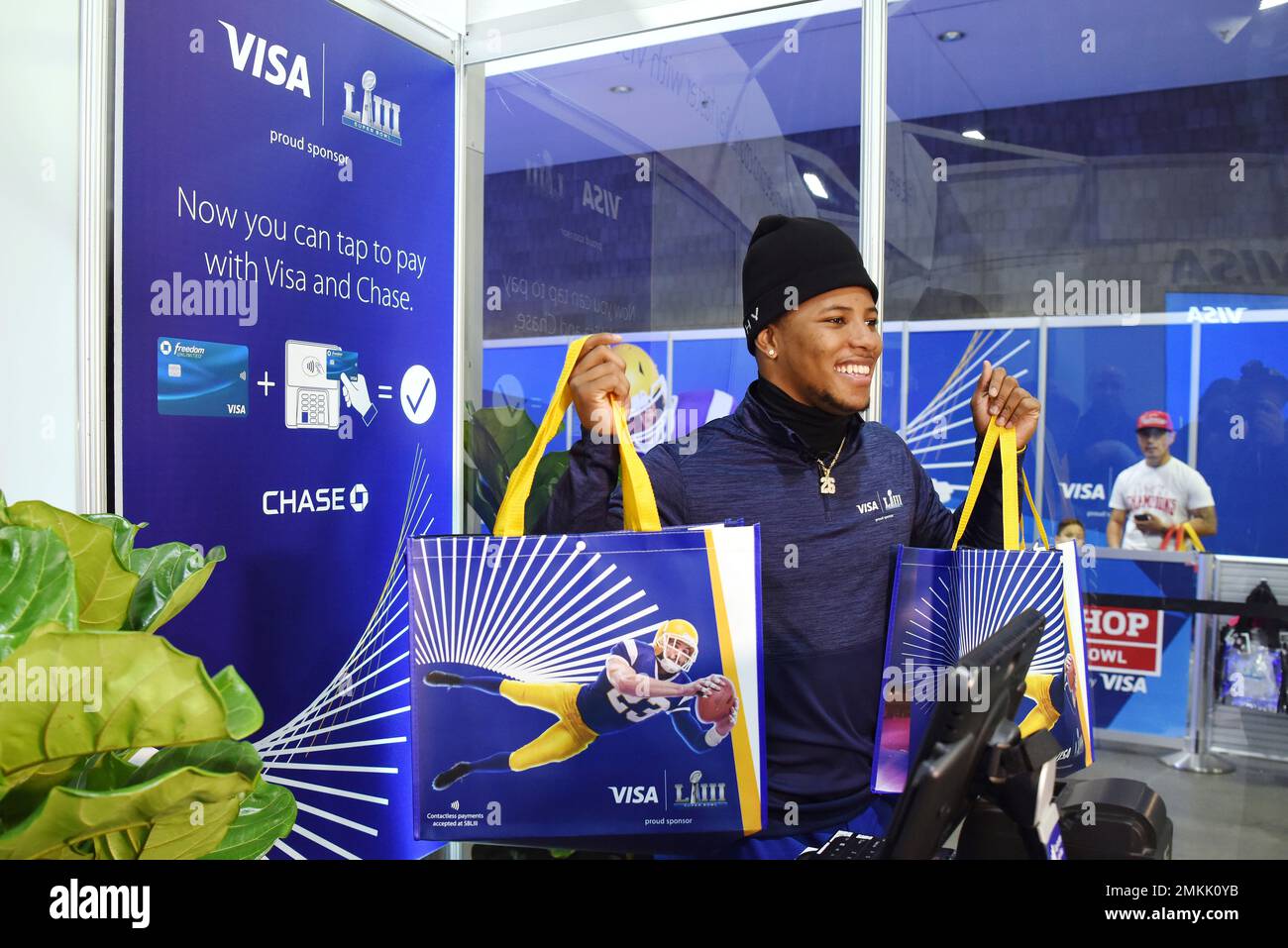 IMAGE DISTRIBUTED FOR VISA - Running back Saquon Barkley takes over cash  register duties with Visa at the NFL shop, and helped fans tap to pay with  their contactless cards in the