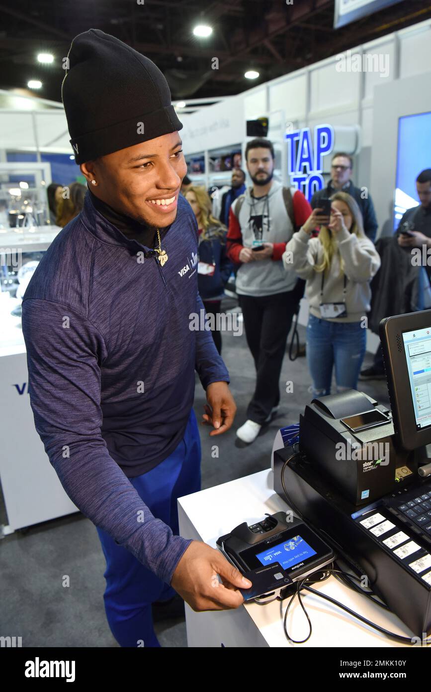 IMAGE DISTRIBUTED FOR VISA - Running back Saquon Barkley joins Visa at the NFL  Shop to show fans how to tap to pay with Visa contactless cards, Thursday,  Jan. 31, 2019, in