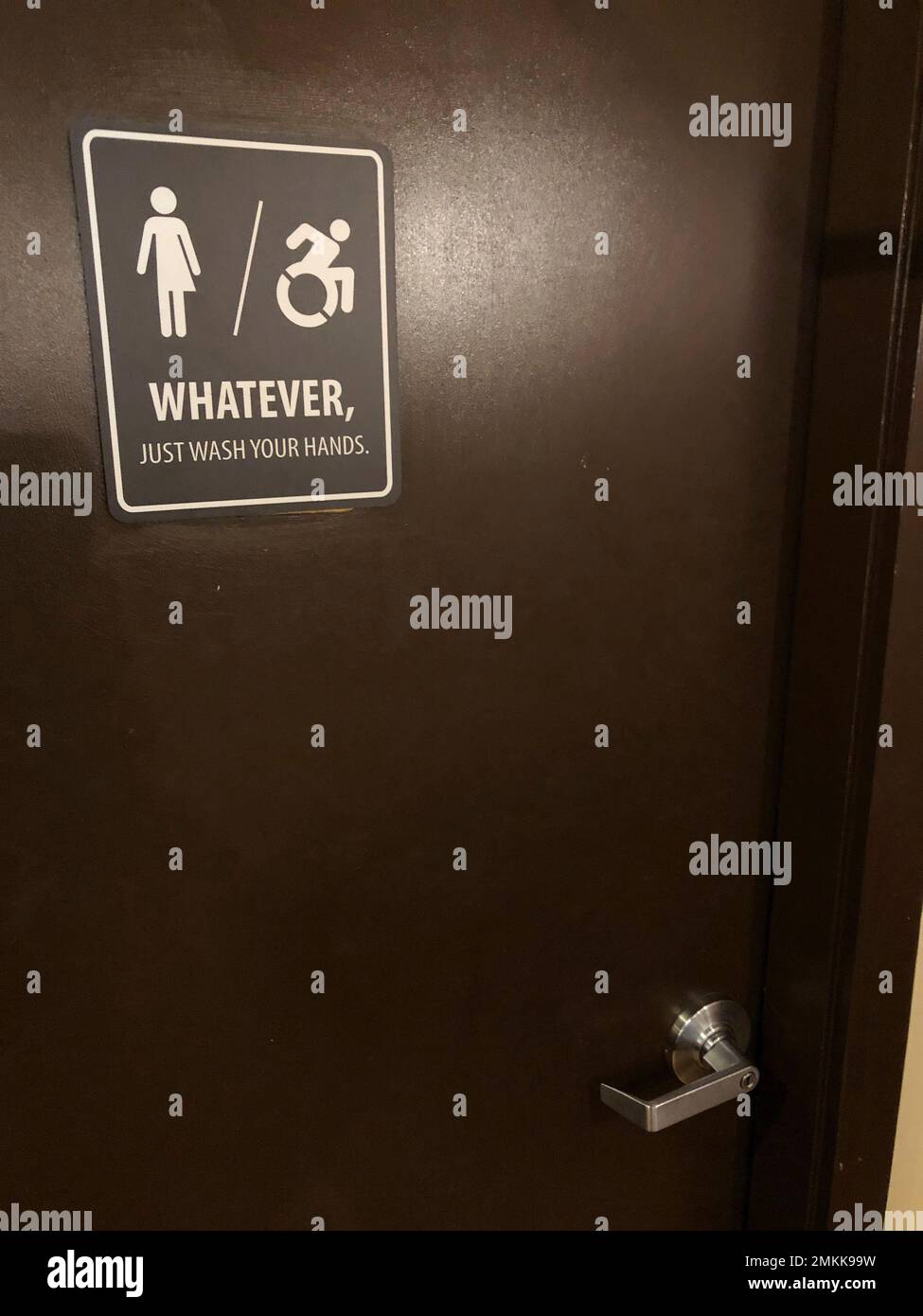 A sign is posted on a restroom door for general use by all patrons in a restaurant on Monday