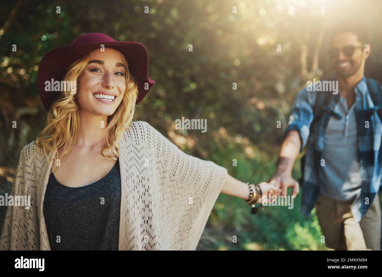 Going for a walk in the woods. a happy young couple exploring nature