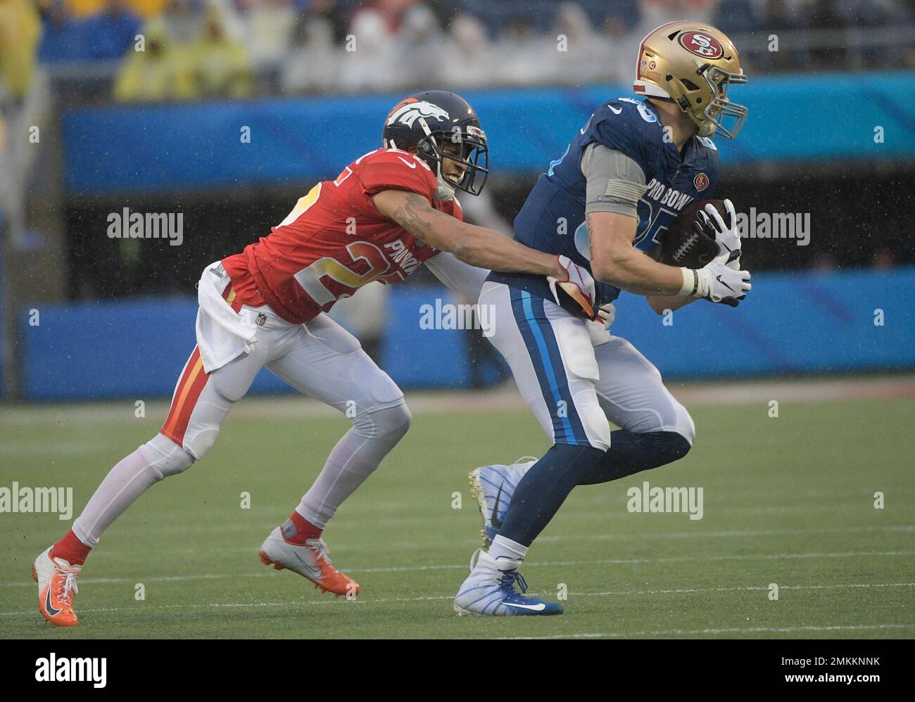 AFC cornerback Chris Harris Jr. 25 of the Denver Broncos stops NFC tight end George Kittle 85 of the San Francisco 49ers after a reception during the second half of the NFL