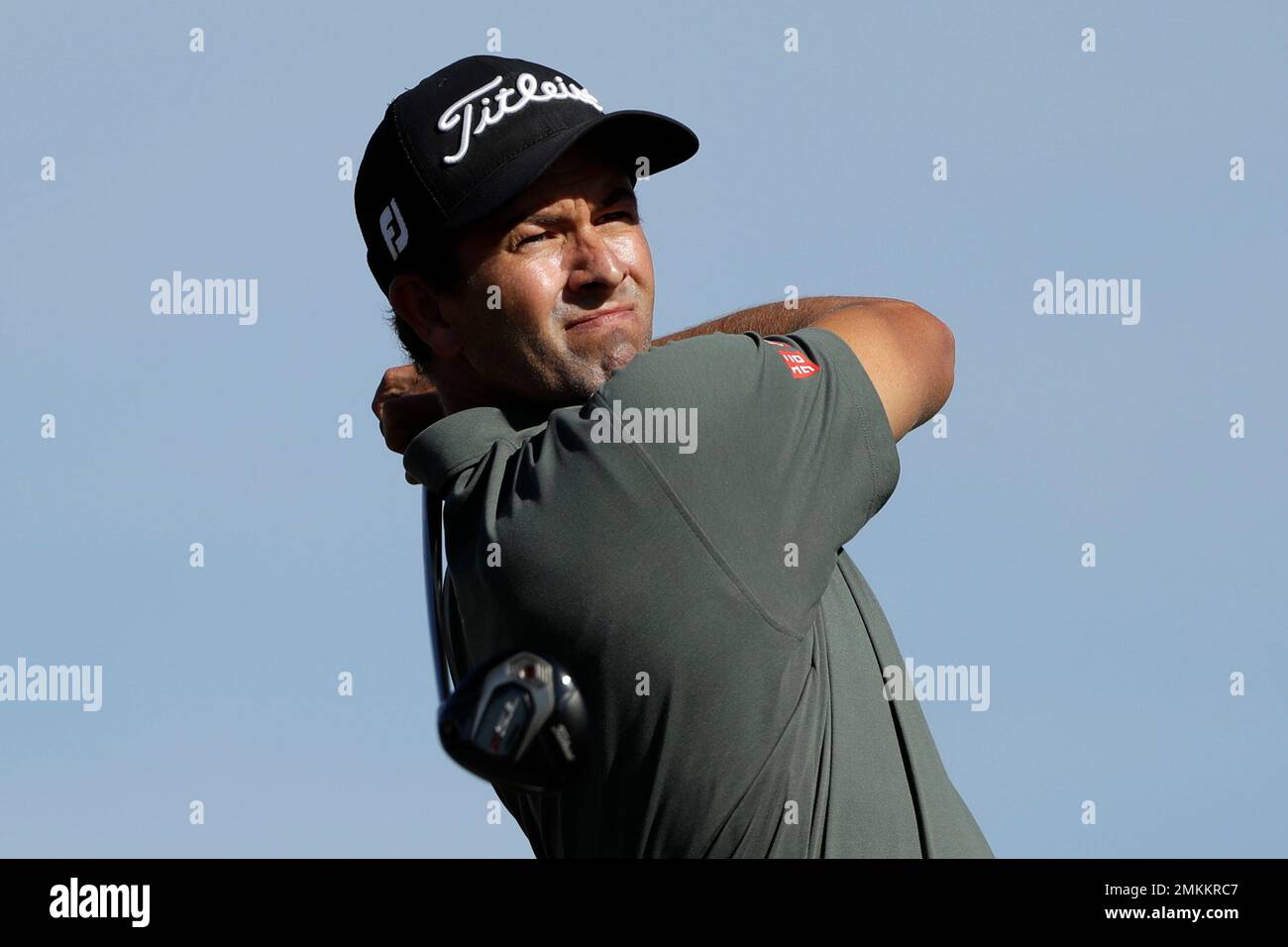 Adam Scott, of Australia, watches his tee shot on the second hole of ...