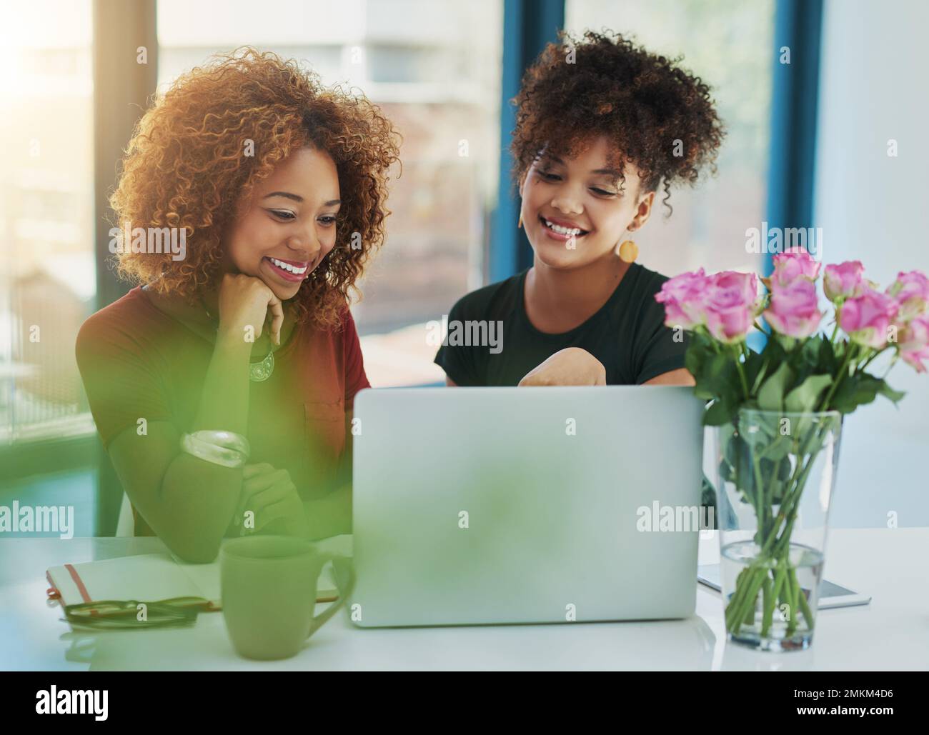 Together we can do great things. two young designers working on a laptop together. Stock Photo