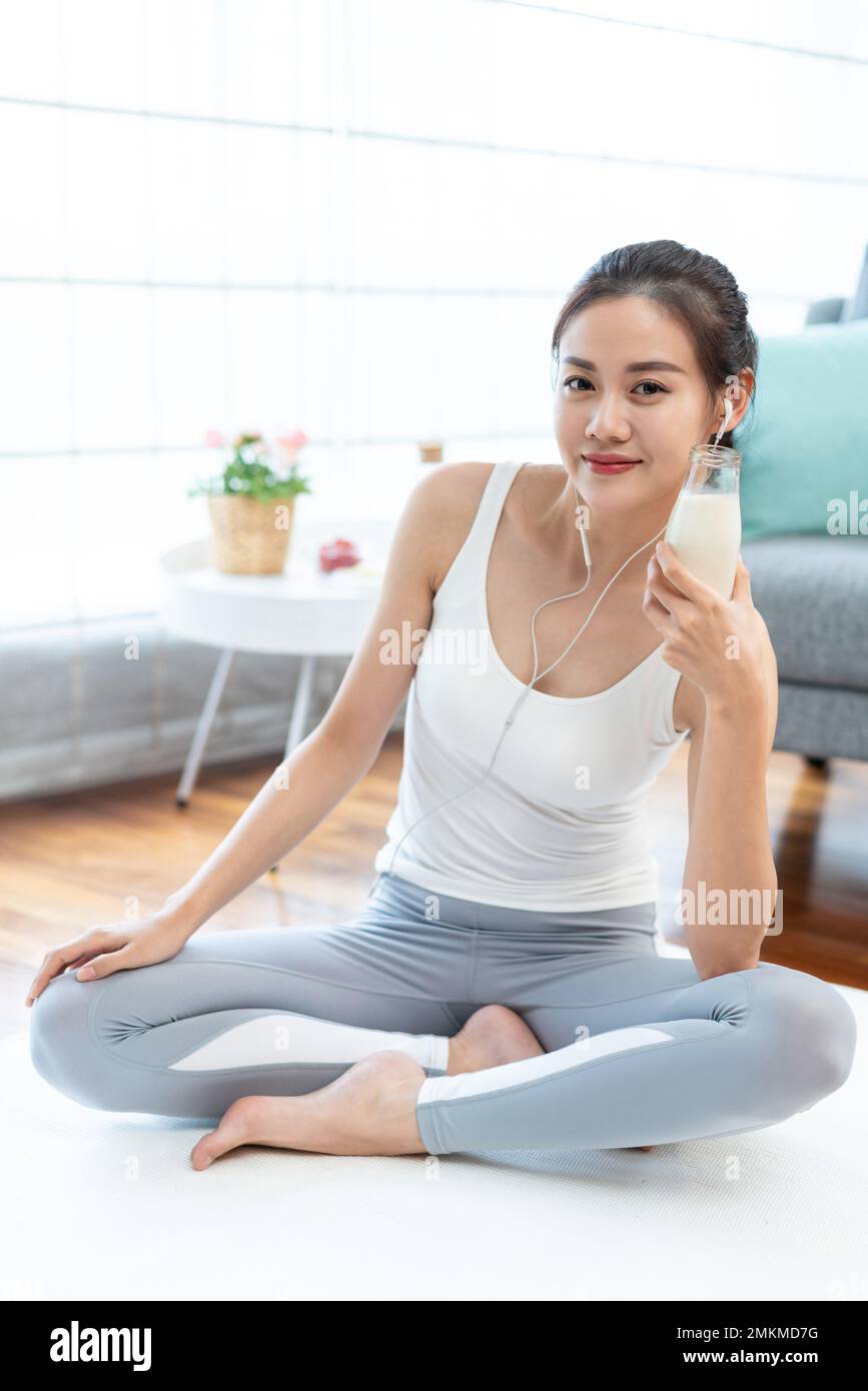 The young woman rest to drink milk after exercise Stock Photo Alamy