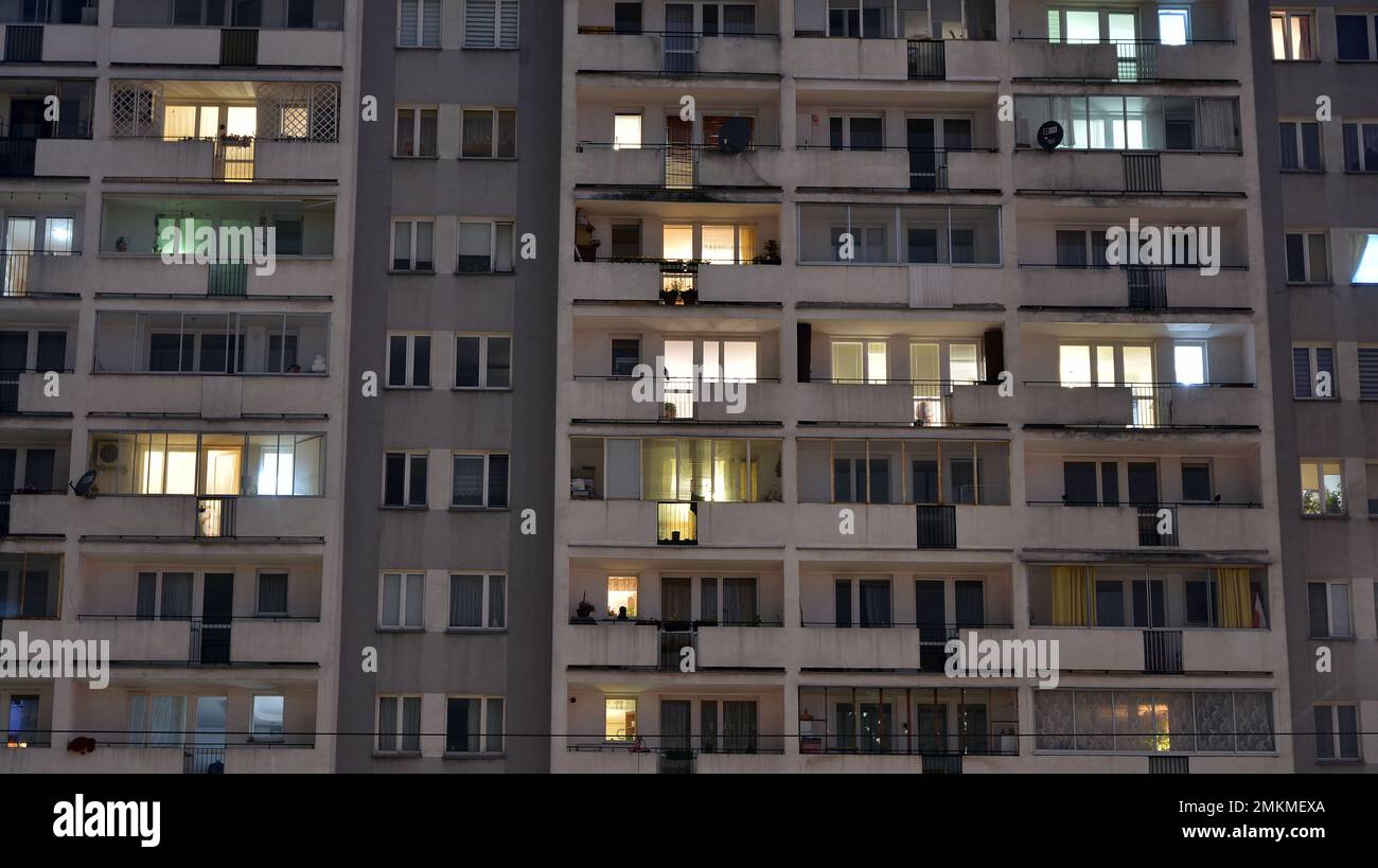 Pattern of office buildings windows illuminated at night. Glass ...