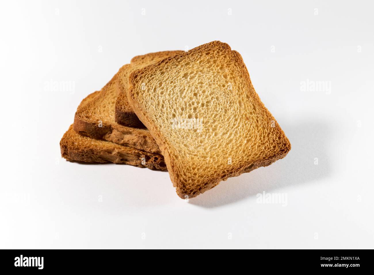 From above of delicious homemade fresh crispy bread rusks on white background Stock Photo