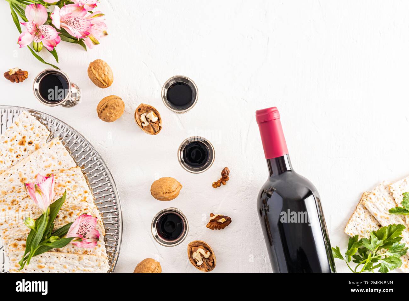 Jewish holiday. passover. white background with silver glasses of red