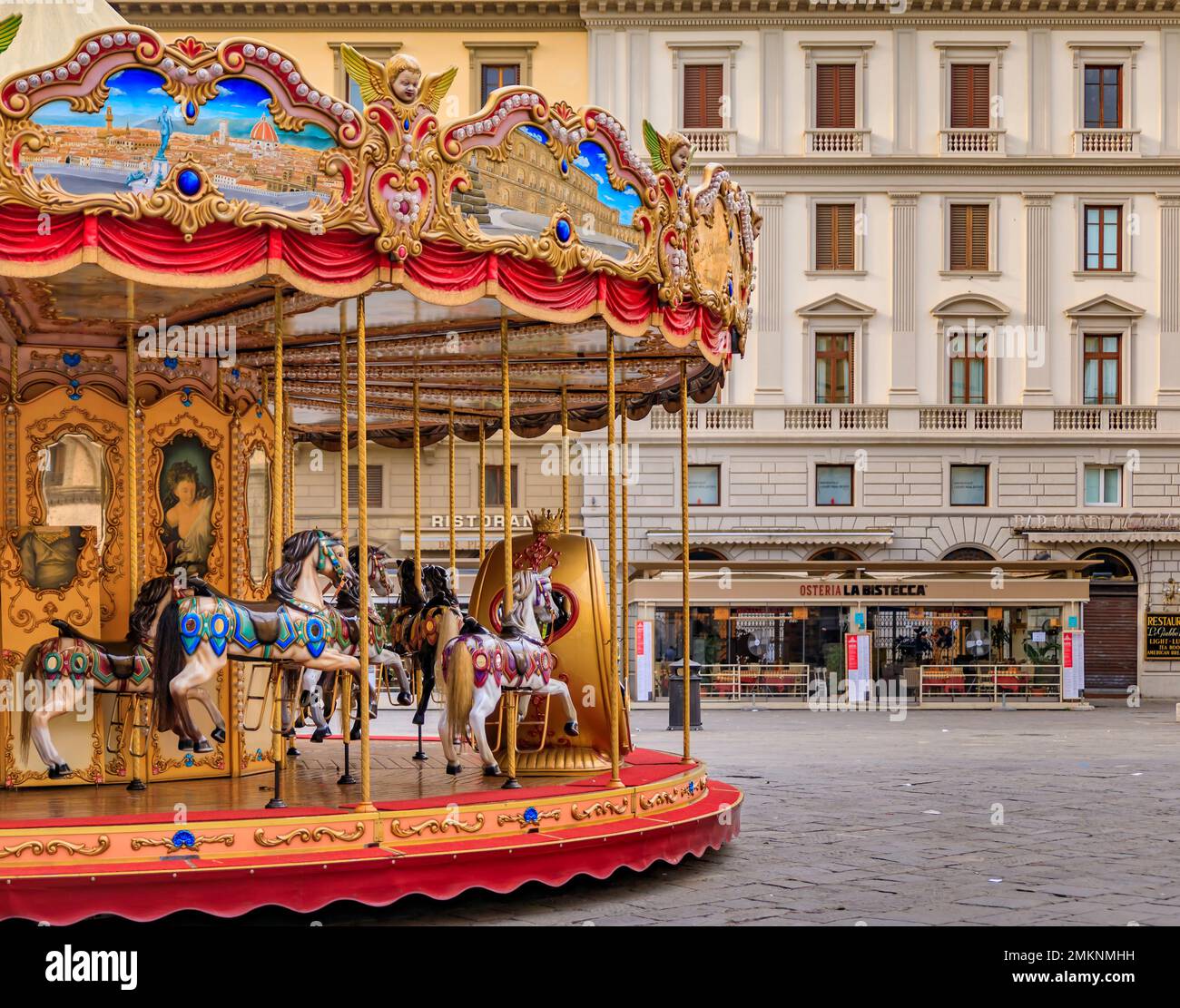 Florence, Italy - June 04, 2022: Ornate antique carousel with wooden horses on Piazza della Republica during the day Stock Photo
