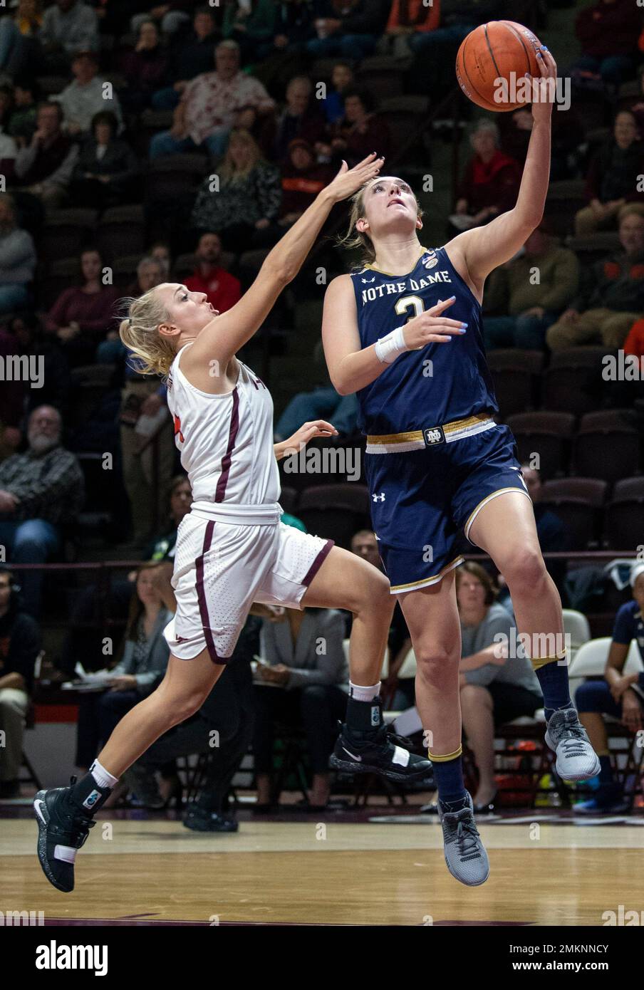 Notre Dame guard Marina Mabrey (3) scores a basket on a steal from her  sister Virginia Tech guard Dara Mabrey, left, during the second half of an  NCAA college basketball game Wednesday