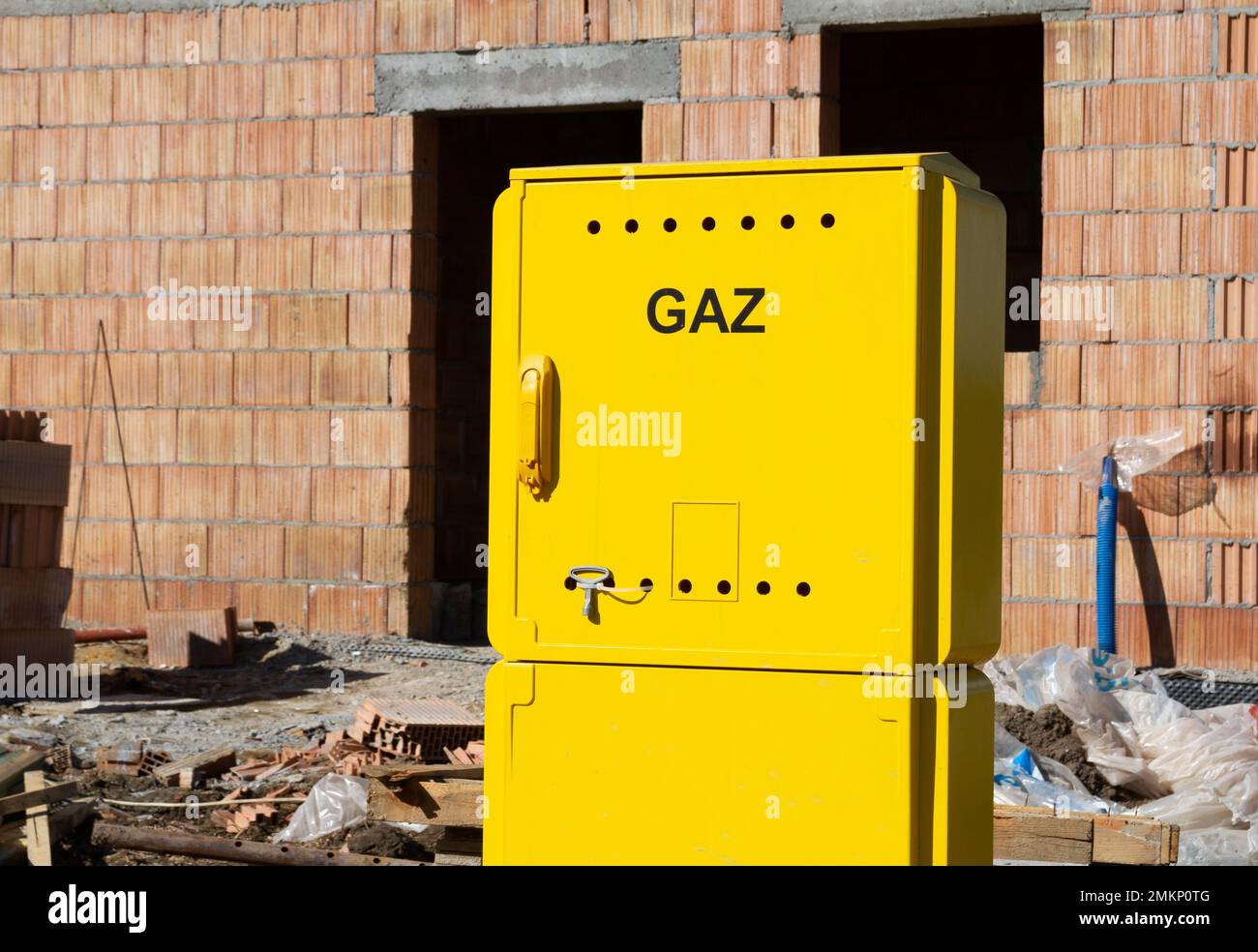 Yellow metal gas connection box at the construction site of new house