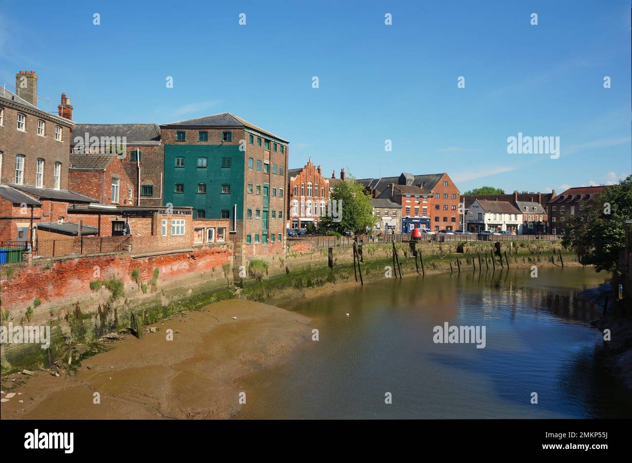 Old buildings down South Street on the river Haven at low tide in the summer Stock Photo