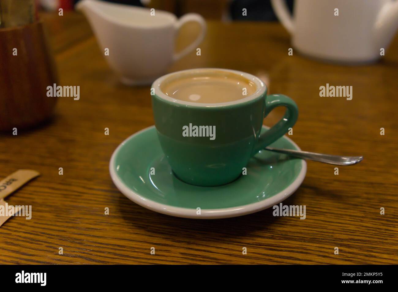 a tiny cup of coffee on a table at the famous Fortnum & Mason department store in Piccadilly. Stock Photo