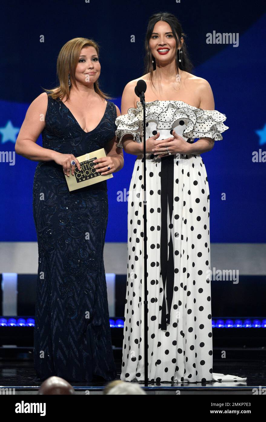 Justina Machado, left, and Olivia Munn present the award for best