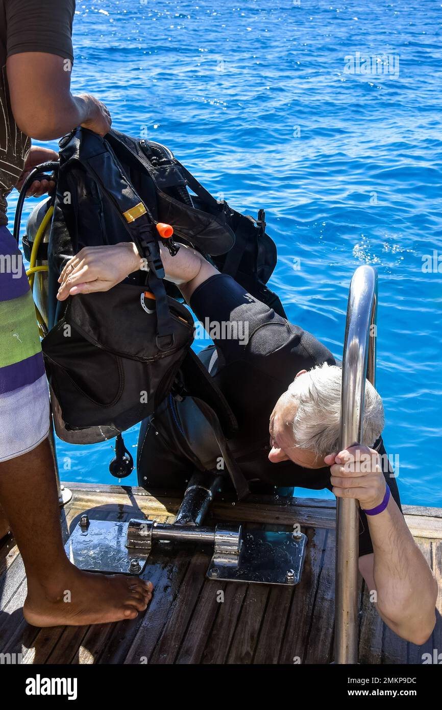 Diver after diving. Diving lesson in open water. Man with scuba diving
