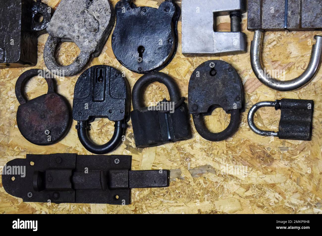 Collection of ancient rusty locks and deadbolt of different shapes and ...