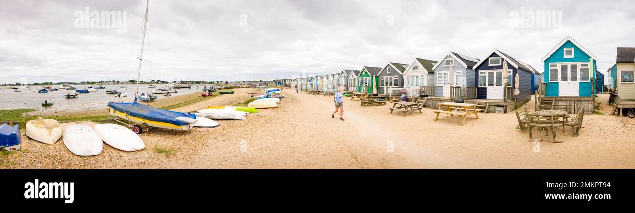 DORSET, UK - July 07, 2022. Panoramic view of Christchurch Harbour with a row of wooden beach huts. Hengistbury Head, Dorset, UK Stock Photo