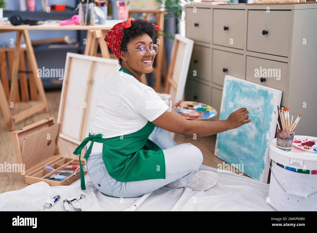 African american woman artist smiling confident drawing at art studio ...