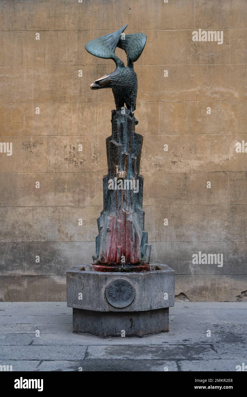 Siena, Italy - August 15 2022: Aquila Contrada Fountain in Siena with Bronze Eagle Statue made by Bruno Buraccini in 1965. Stock Photo