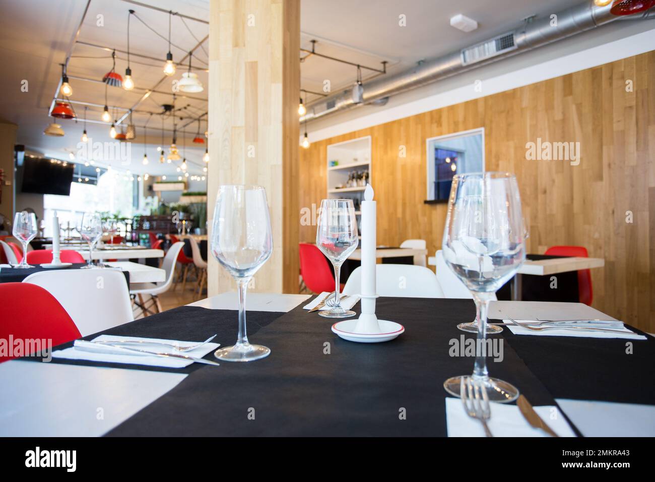 Elegant restaurant table with cutlery, crockery and glasses Stock Photo