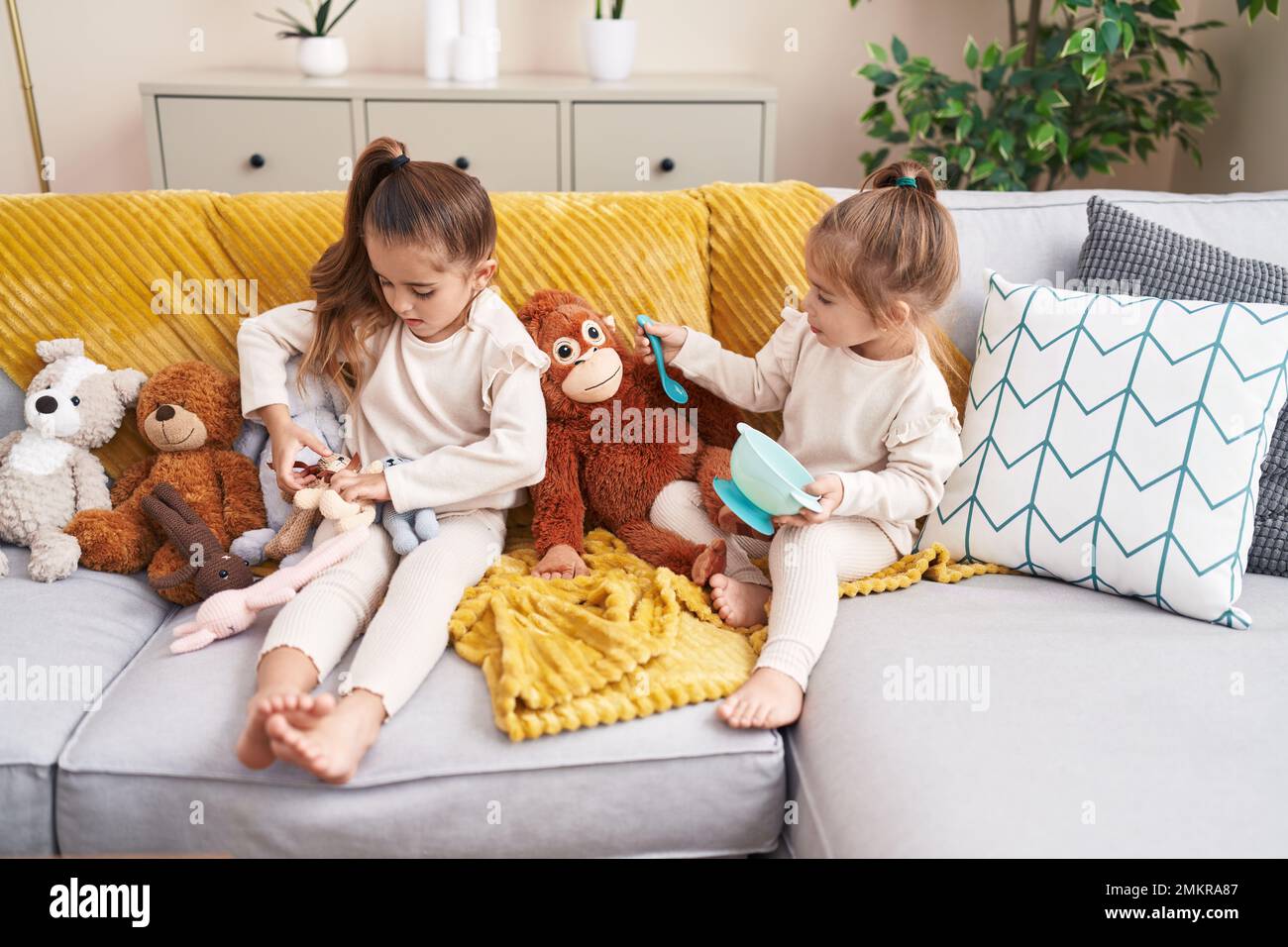 Boy girl playing dolls hi-res stock photography and images - Alamy