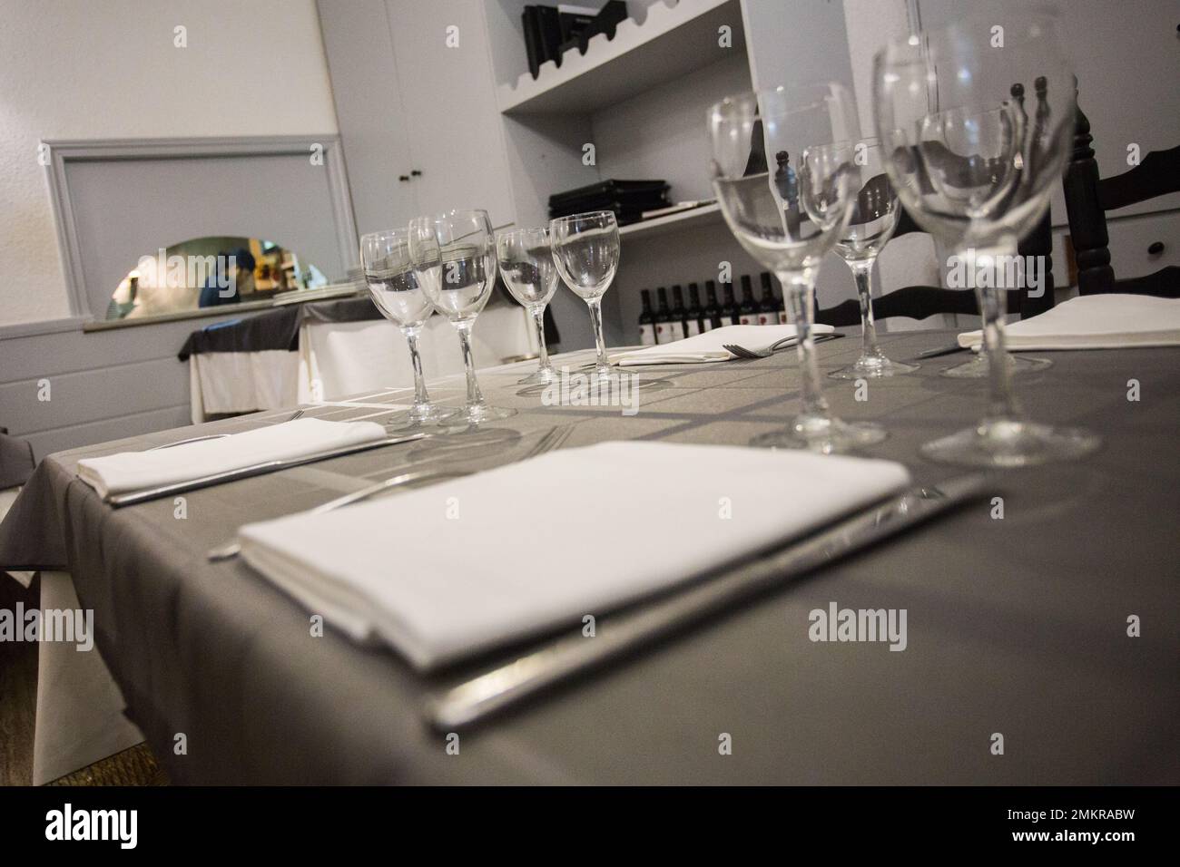 Elegant restaurant table with cutlery, crockery and glasses Stock Photo