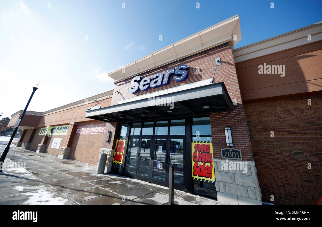 In this Tuesday, Jan. 1, 2019, file photo signs mark the closing of a Sears store in the Streets