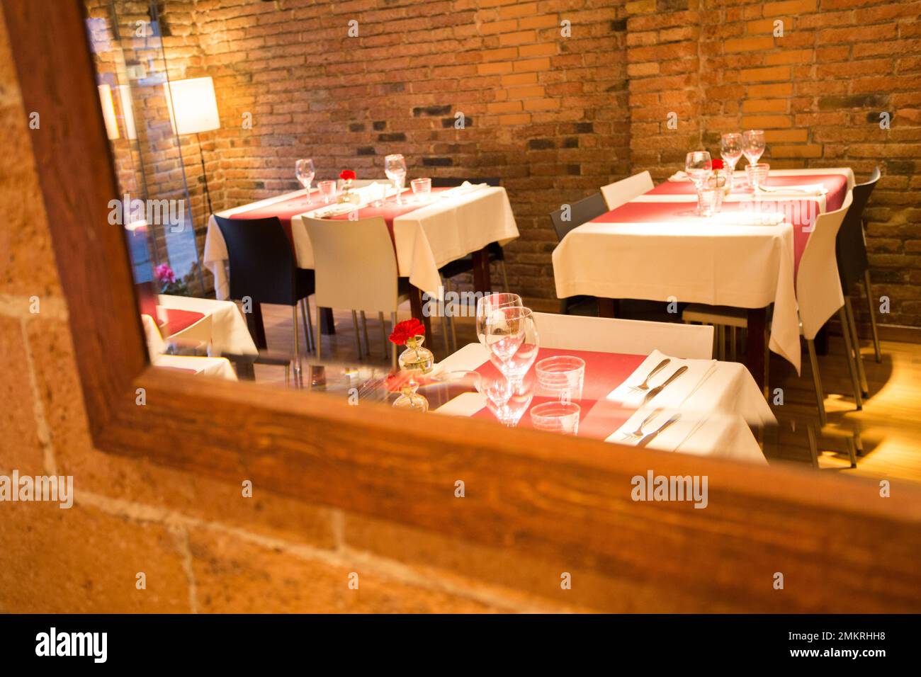 Elegant restaurant table with cutlery, crockery and glasses Stock Photo