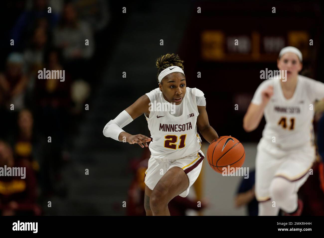Minnesota guard Jasmine Brunson signals against Illinois during an NCAA