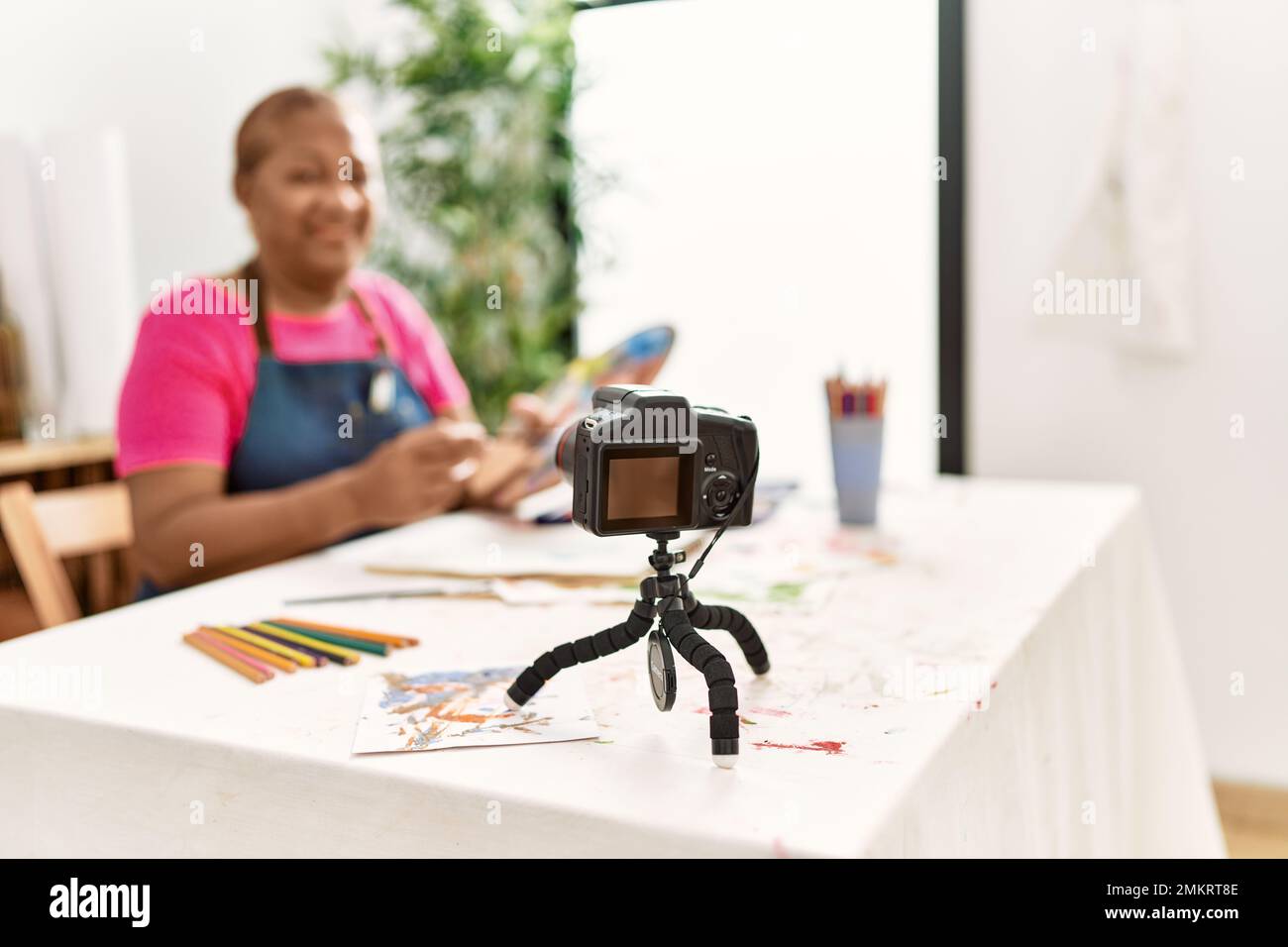 Senior african american woman recording draw tutorial at art studio