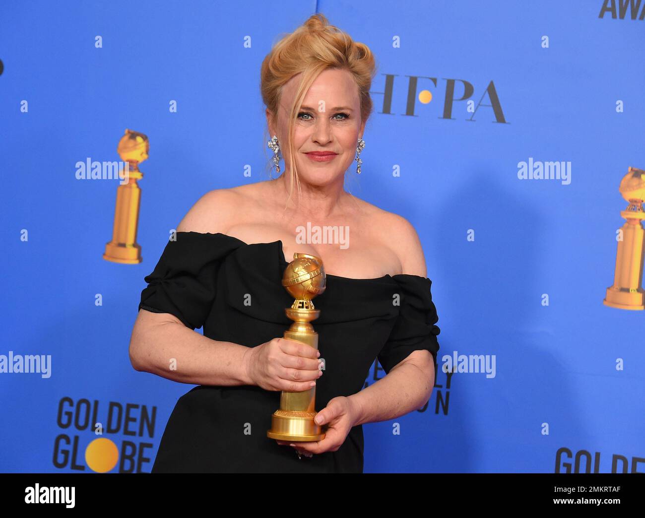 Patricia Arquette poses in the press room with the award for best