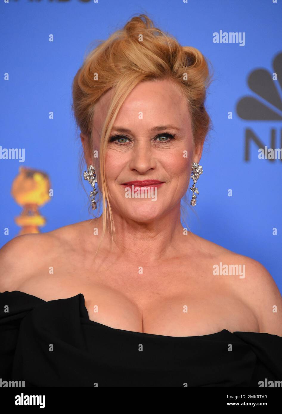 Patricia Arquette poses in the press room with the award for best