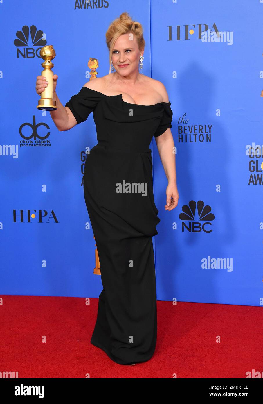Patricia Arquette poses in the press room with the award for best