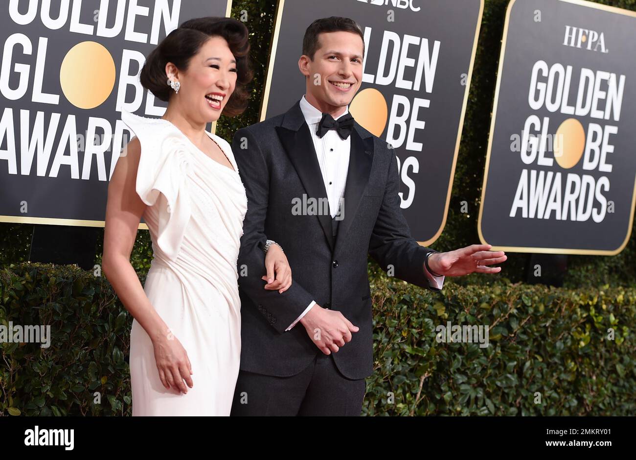 Hosts Sandra Oh, left, and Andy Samberg arrive at the 76th annual
