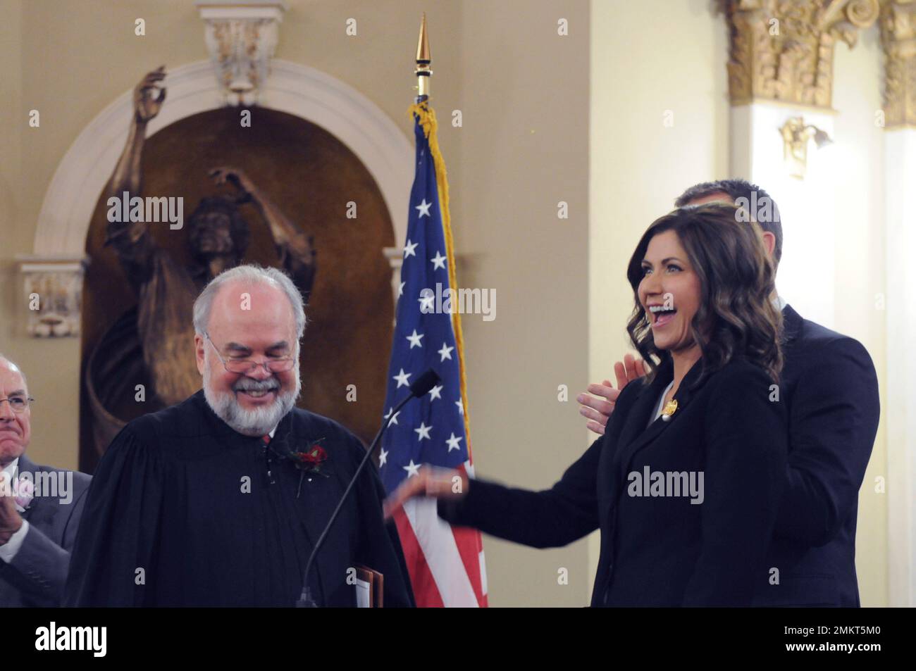 Gov. Kristi Noem waves after being sworn in to office as South Dakota's(09)
