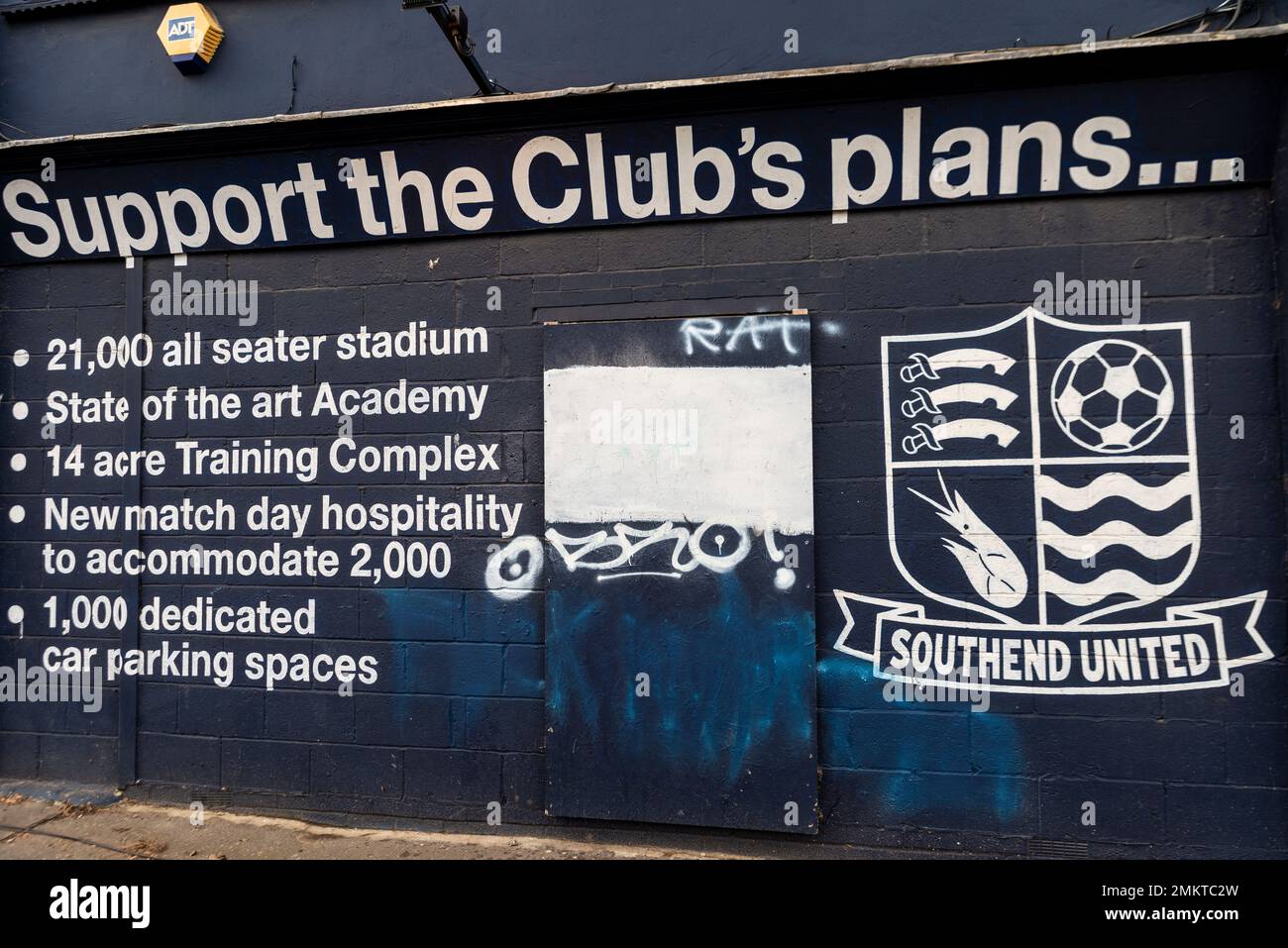 Support the club's plans message at Roots Hall stadium, Southend Utd football ground, Southend on Sea, Essex, with anti Ron Martin graffiti covered Stock Photo