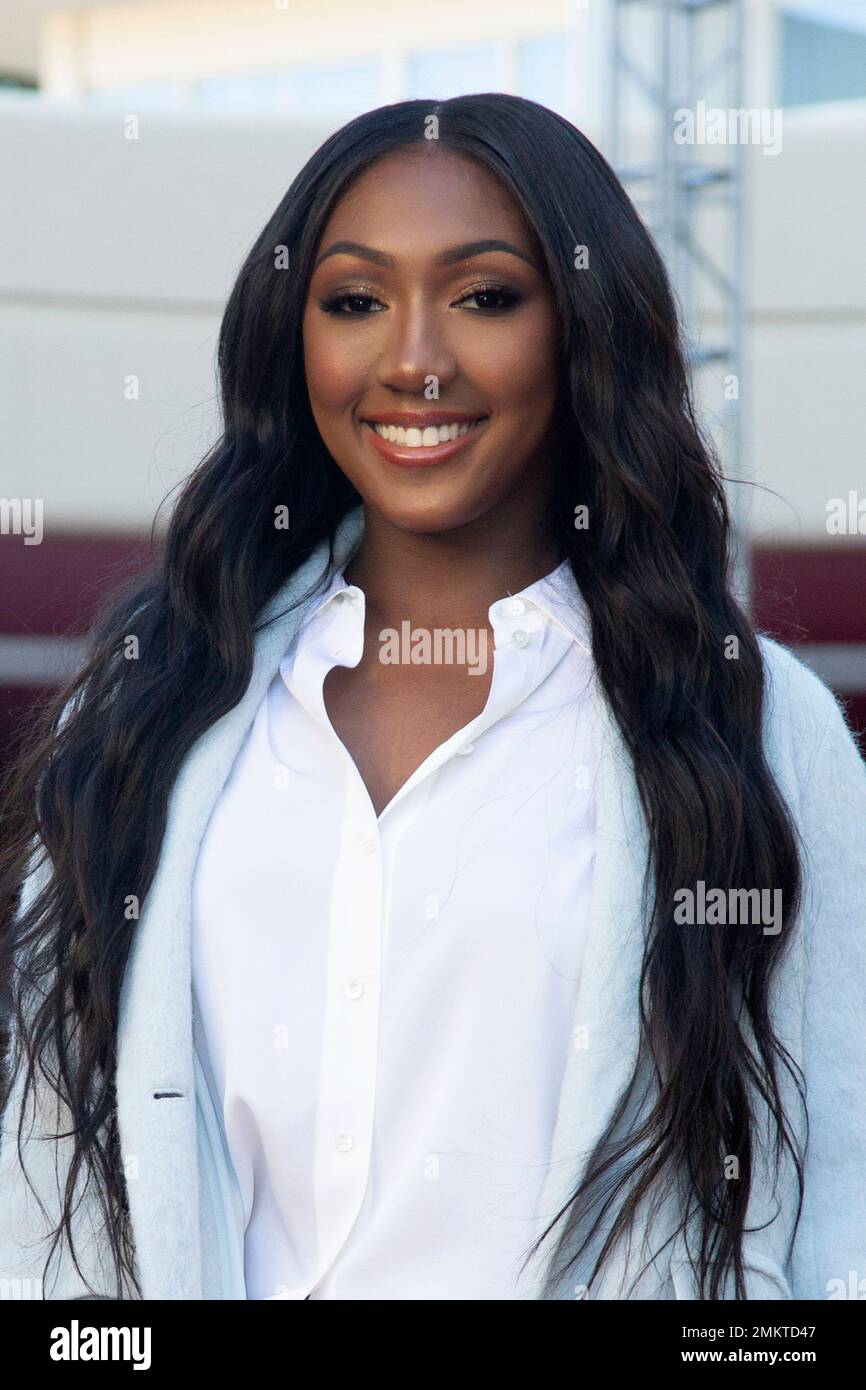 Isan Elba poses for a photo after rolling-up the red carpet at the 76th