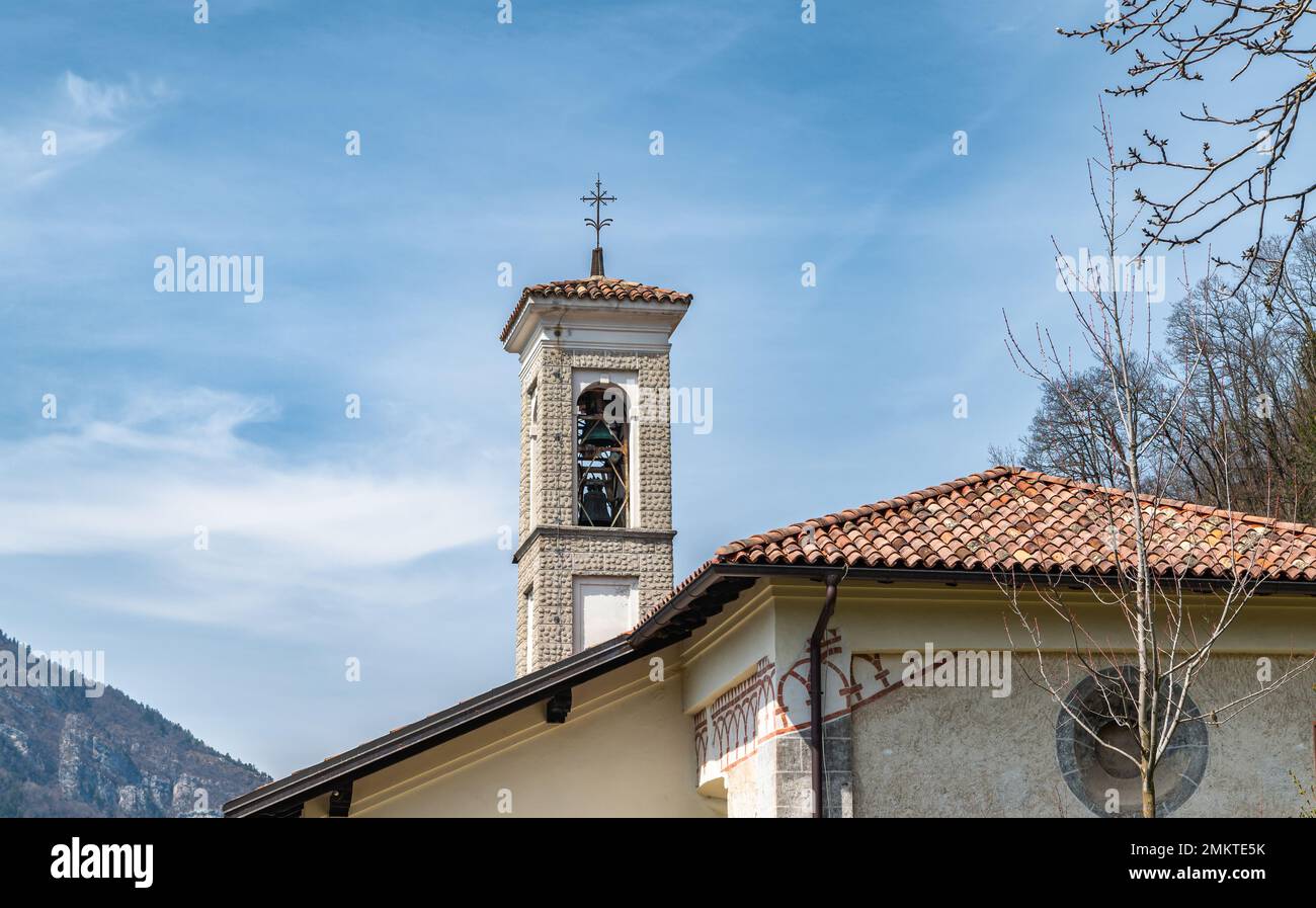 the bell tower of the Church of the Dedication of Sait Michael: is located in Mezzolago Village, Ledro Valley, Trentino Alto Adige - Europe Stock Photo