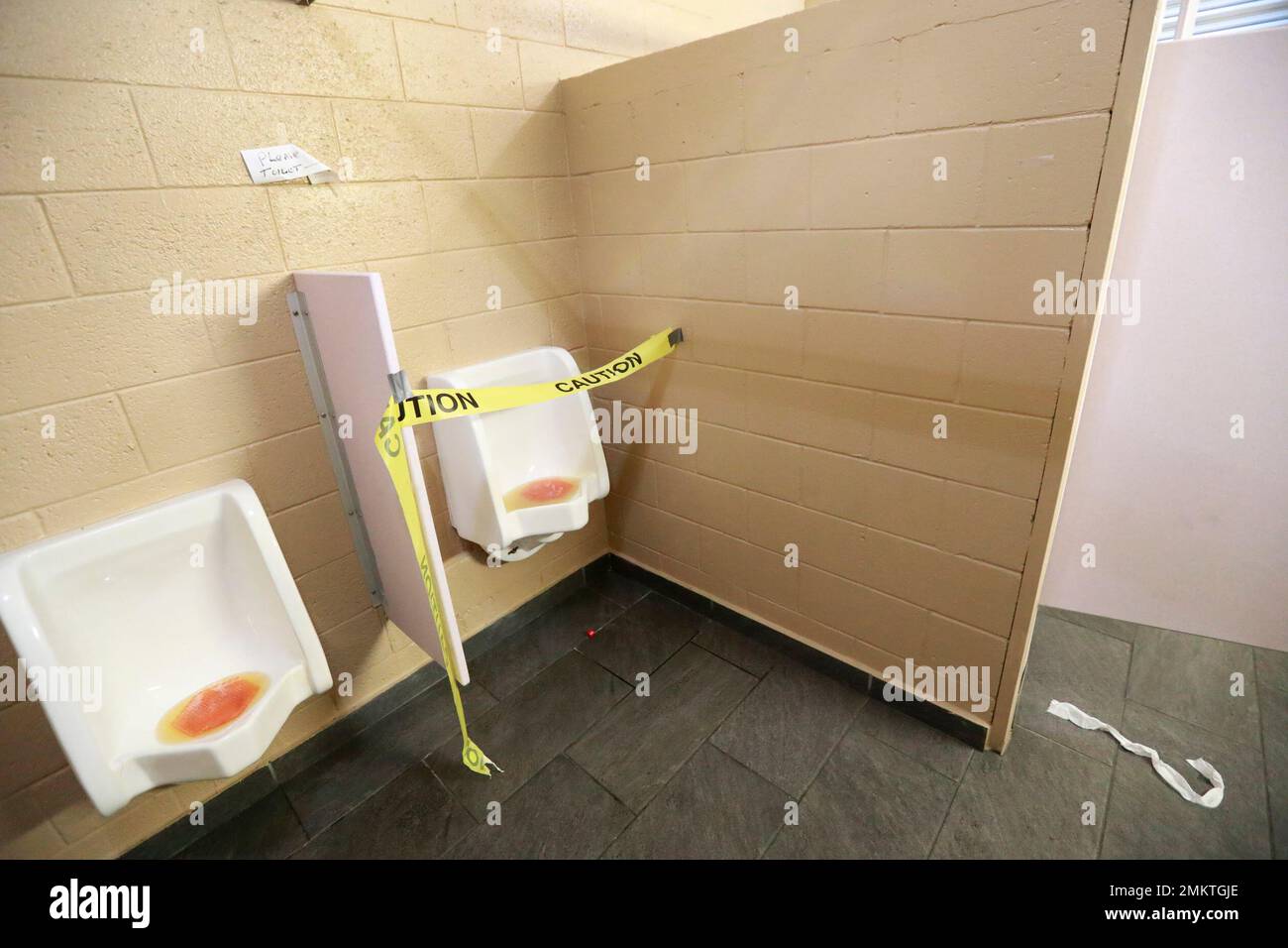 Caution tape blocks urinals in the mens restroom, Wednesday, Jan. 2 ...