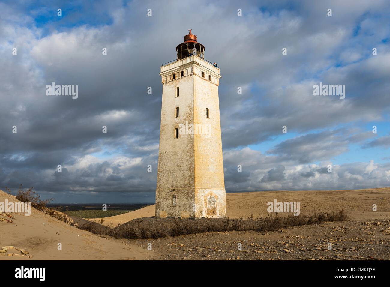 Rubjerg Knude Fyr lighthouse on the Rubjerg Knude shifting sand dune on the coast of North Jutland, Denmark, glows in the evening sun Stock Photo