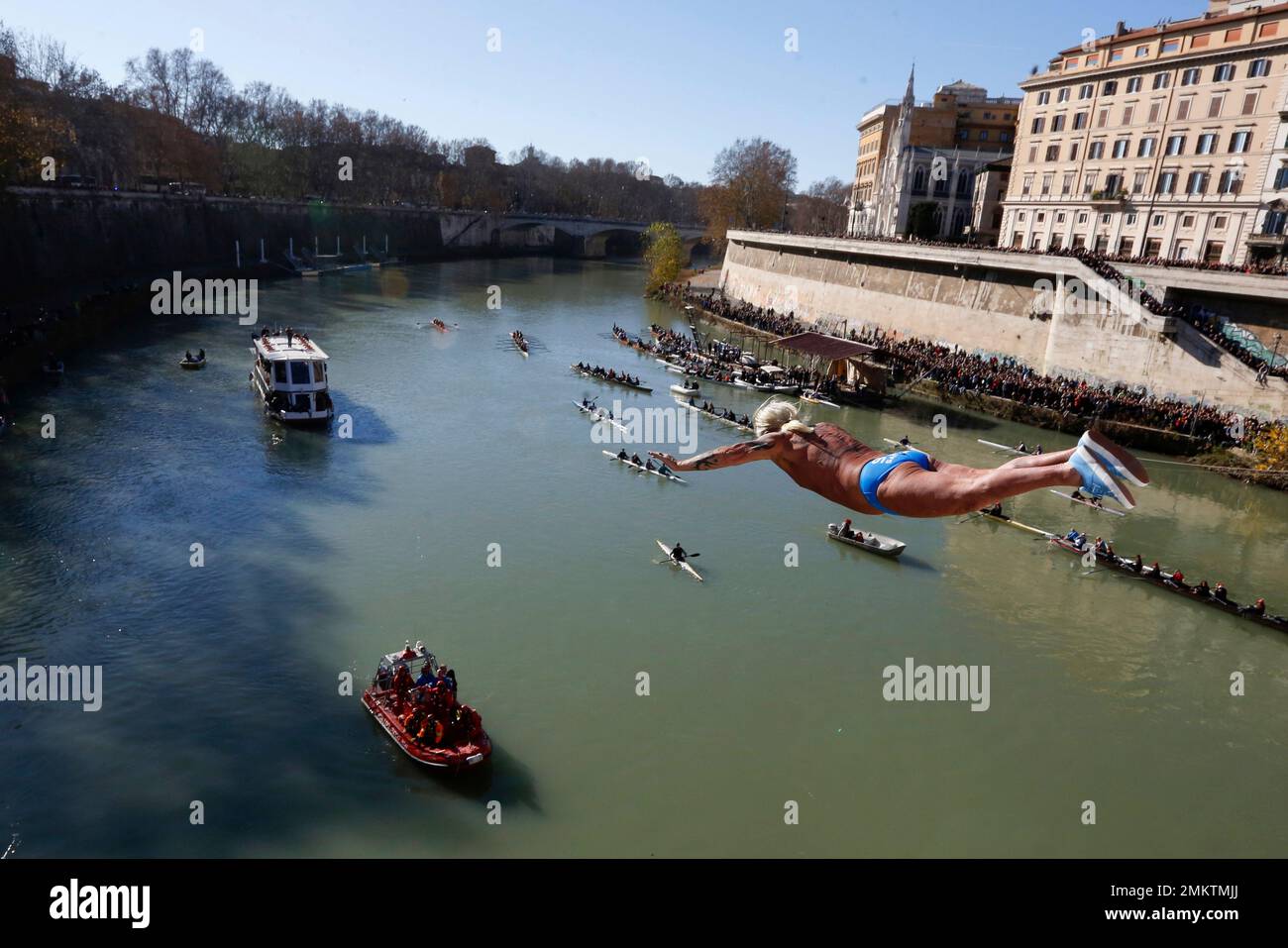 Maurizio Palmulli of Italy dives into the Tiber river from the 18 meters 59 feet high Cavour Bridge in Rome Tuesday Jan. 1 2019. AP Photo Riccardo De Luca Stock Photo Alamy