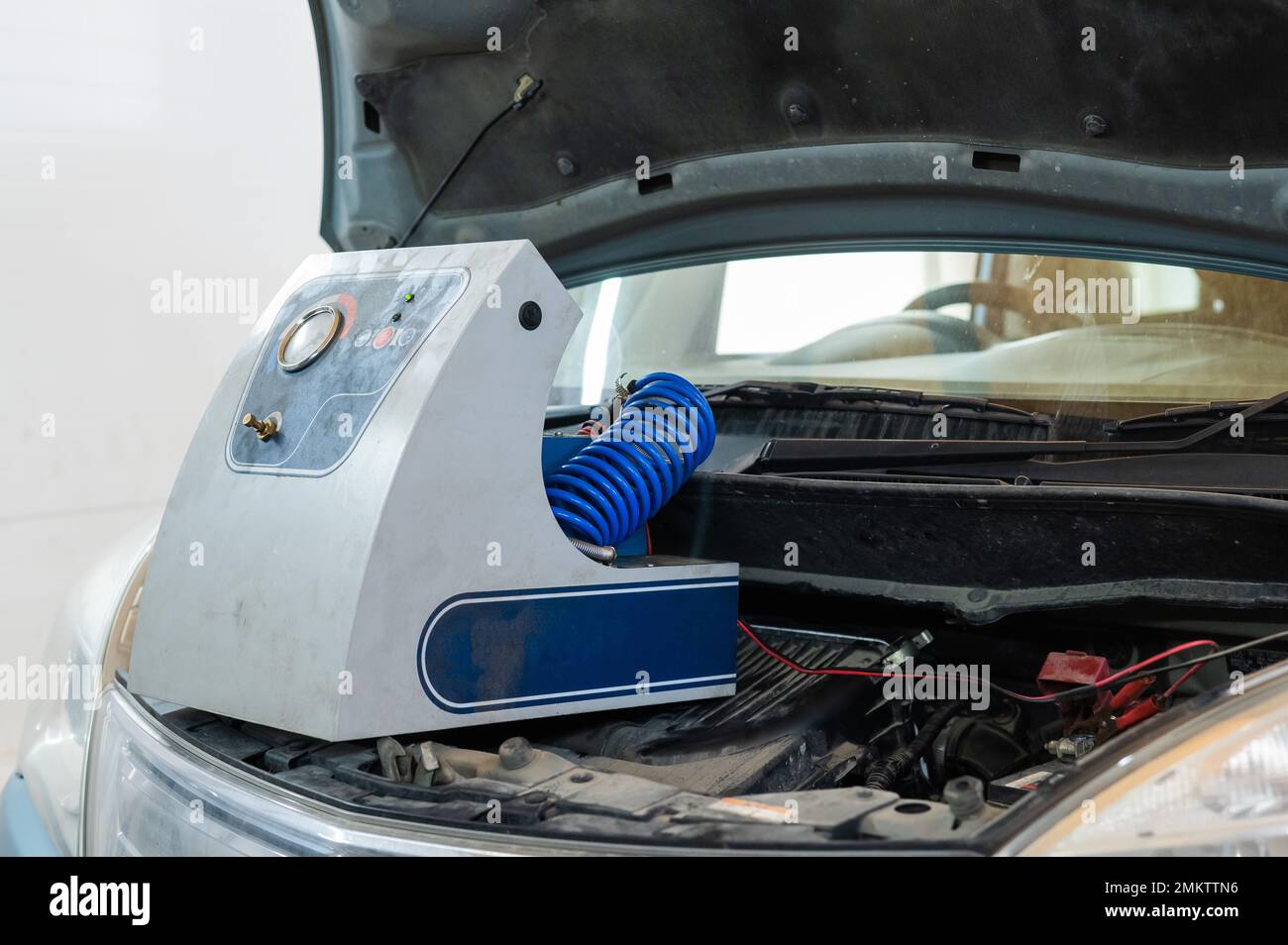 Automated change of brake fluid in a car service. Car Stock