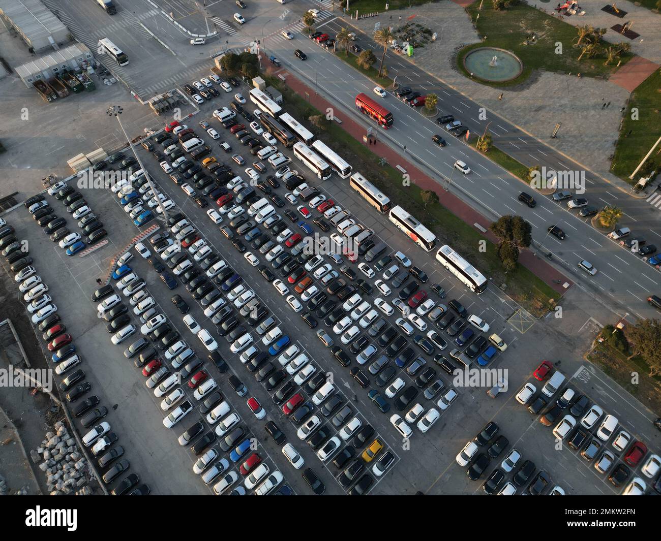 Aerial view over huge outdoor parking lots with many cars and vehicles in Genoa, Italy Stock