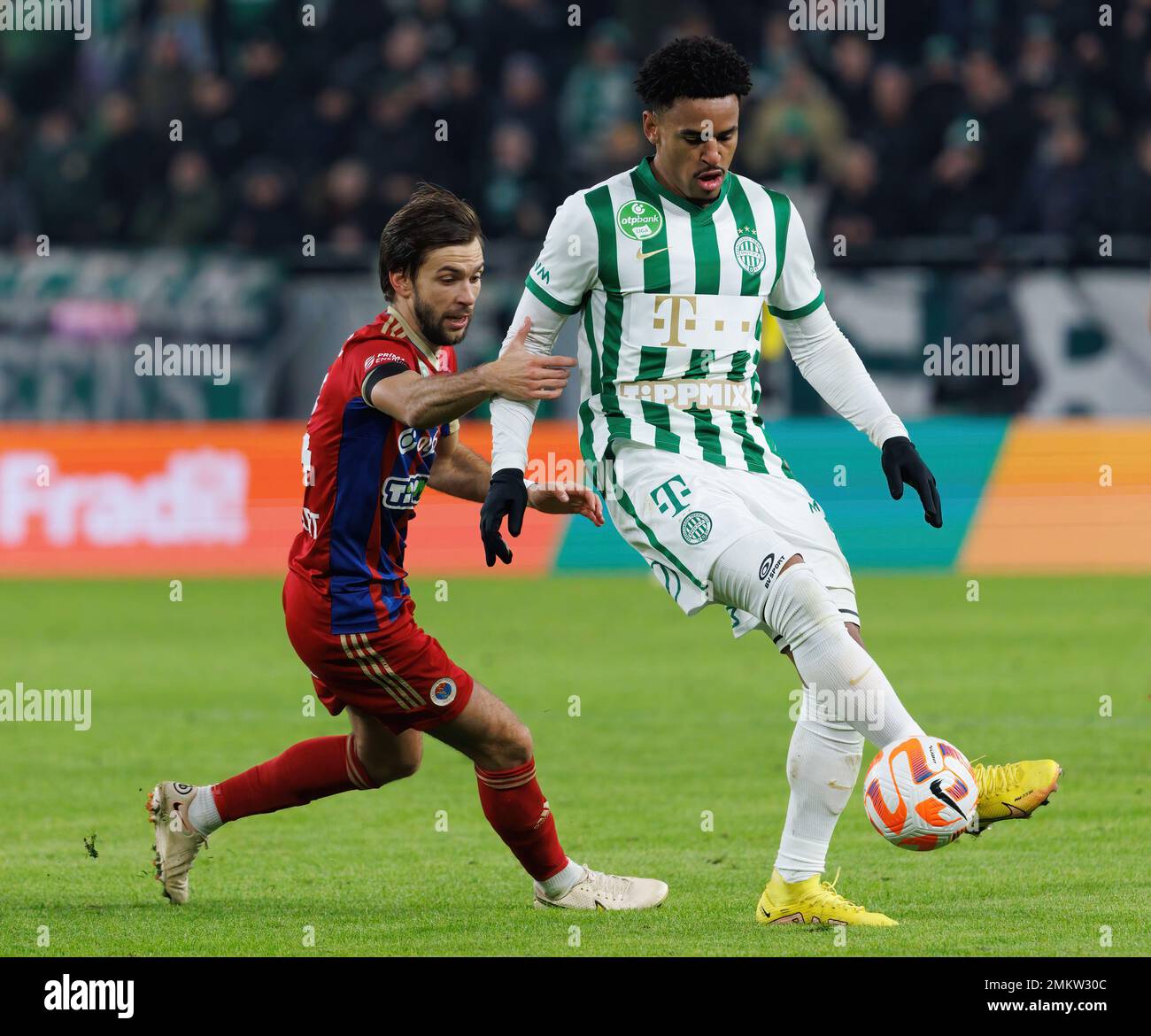 BUDAPEST, HUNGARY - MARCH 2: (r-l) David Markvart of DVTK controls the ball  next to Roland Varga of Ferencvarosi TC during the Hungarian OTP Bank Liga  match between Ferencvarosi TC and DVTK