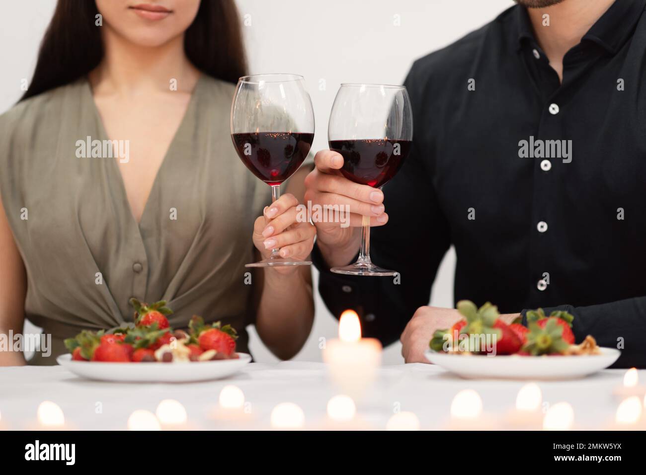 Cropped of couple in love celebrating anniversary at restaurant Stock Photo